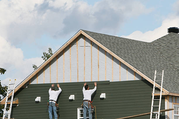 Professional Storm Damage Siding Repair technician working in Elkwood, VA